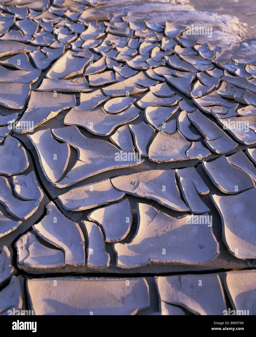 tides low ebb tide earth crusts cracked salt crusts France Europe near Mont St. Michel coast sea scenery Stock Photo