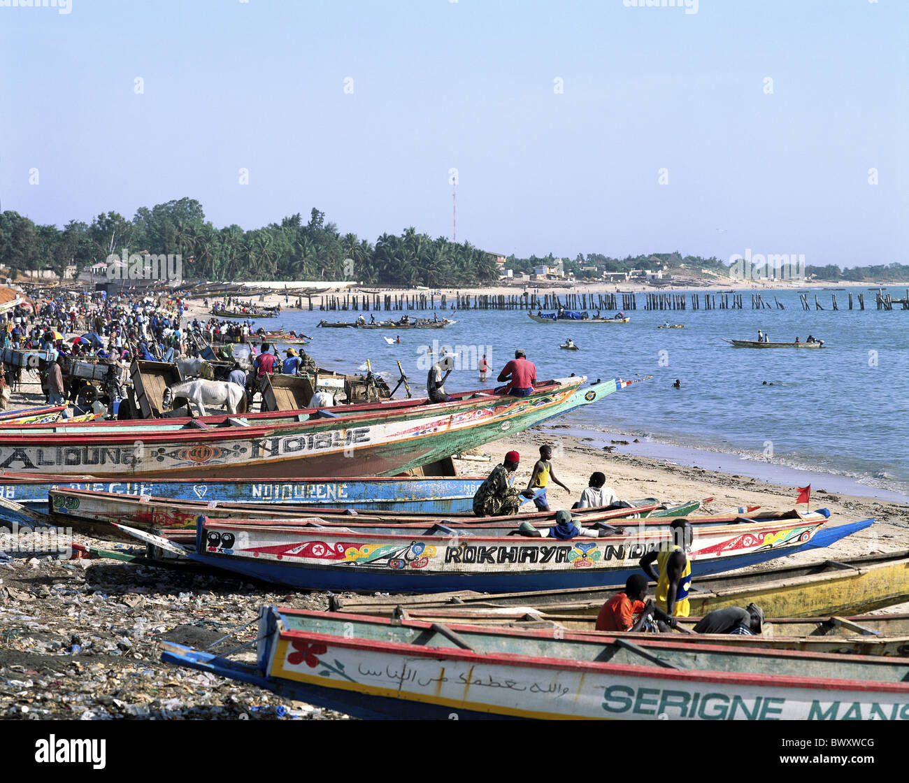 busy 10495599 paints Fischer fishing boats coast life Mbour Senegal Africa beach seashore Stock Photo