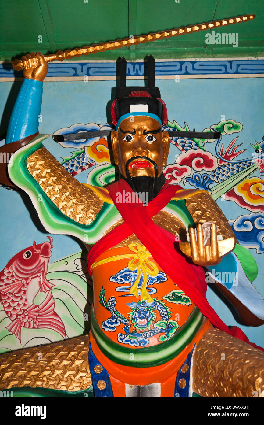 Colourful temple guardian, Animist Three Star Temple, Jinsuo Island, near Dali, Yunnan Province, China Stock Photo