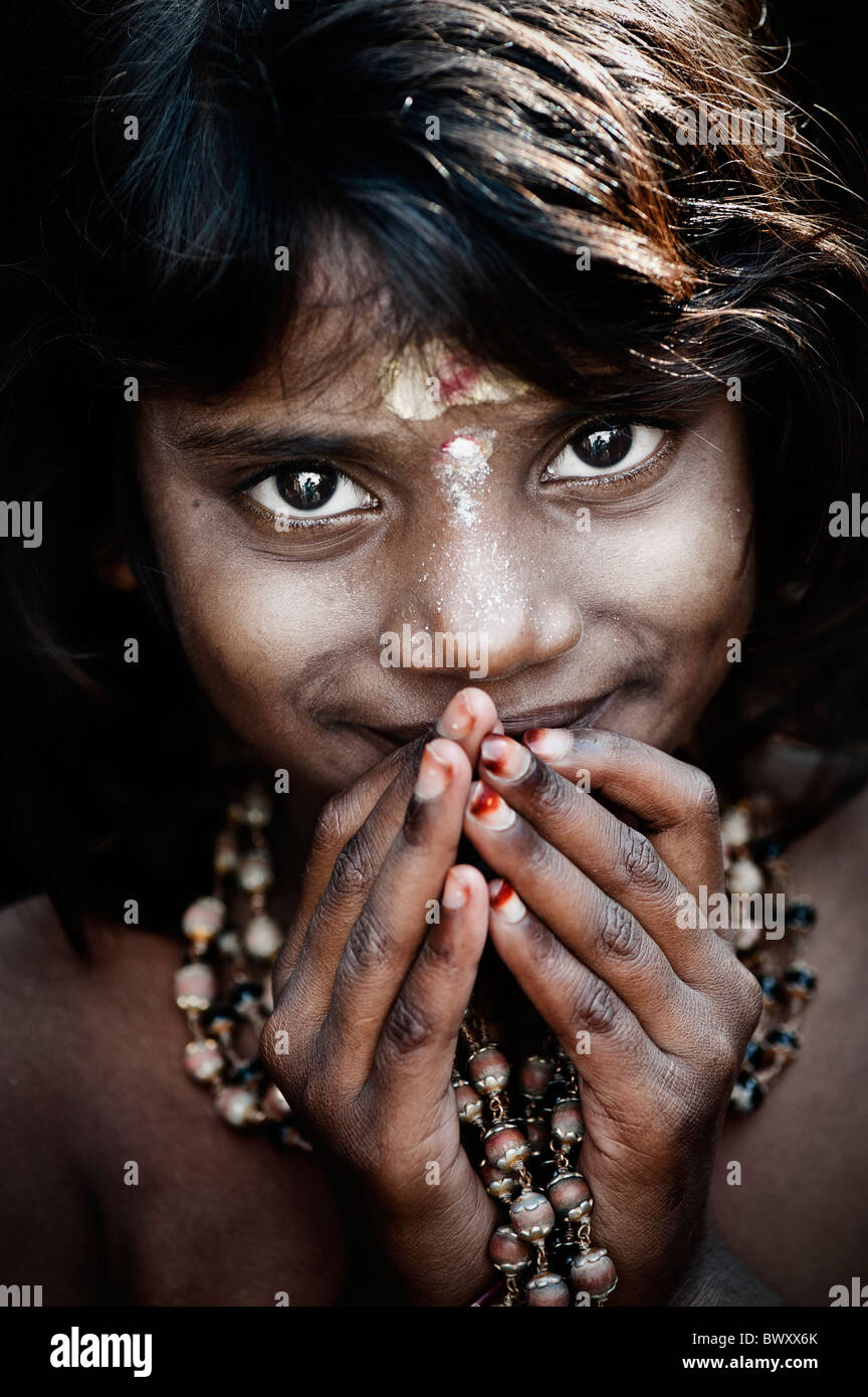 Smiling Indian girl on Ayappa pilgrimage. Puttaparthi, Andhra Pradesh, India. Sepia Tone Stock Photo
