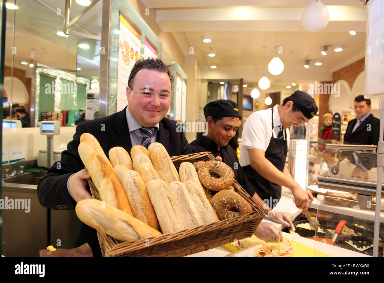 Robbie, Islam & Eggy, staff at Centra, 7/24 supermarket, Dublin, Ireland Stock Photo