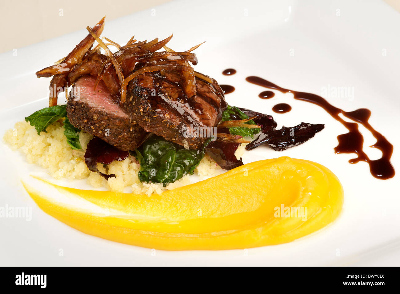 Grilled Blesbok loin with pumpkin pickled dates, lime and krummel pap at Zachary's restaurant, Pezula Resort in Knysna. Stock Photo