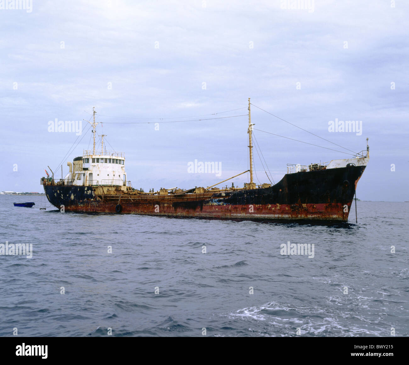 retired freighter freight hauler Maldives Indian ocean sea rust ship shipping accident casualty wreck Stock Photo