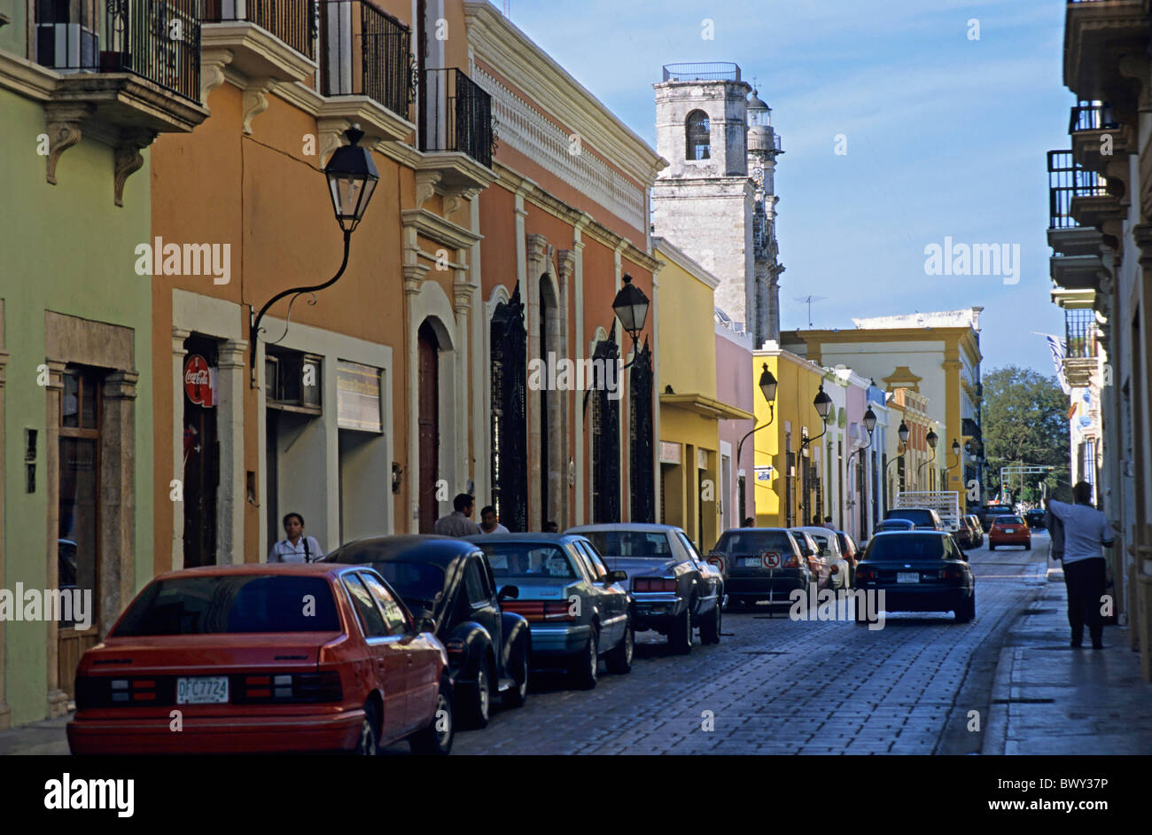 Colorful building facades and parked cars in a street, Campeche town, Mexico. Stock Photo
