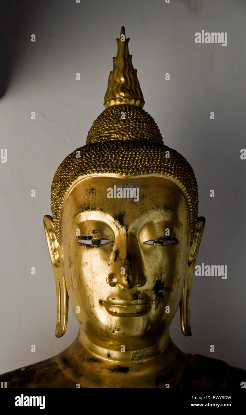 A golden Buddha statue in Wat Pho temple in Bangkok in Thailand in ...