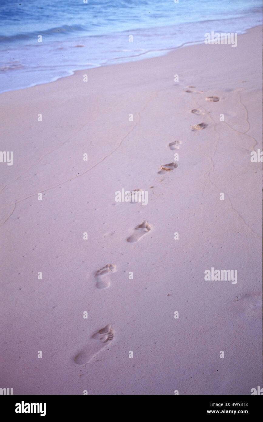 beach footprints impressions sand sea seashore tracks Stock Photo