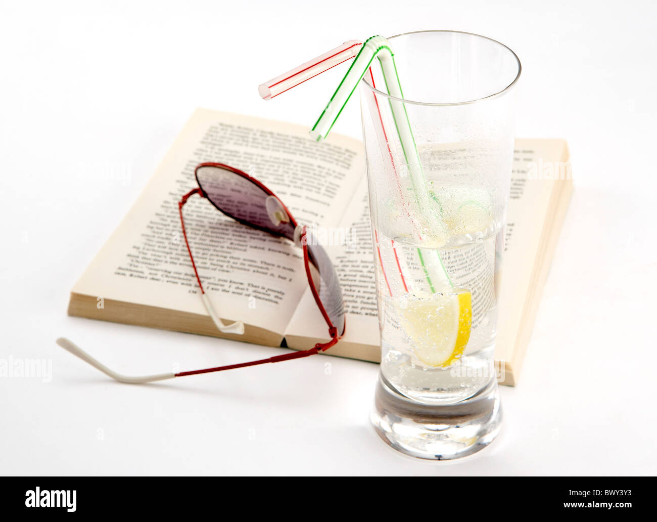 still life on white background book sunglasses and drink Stock Photo