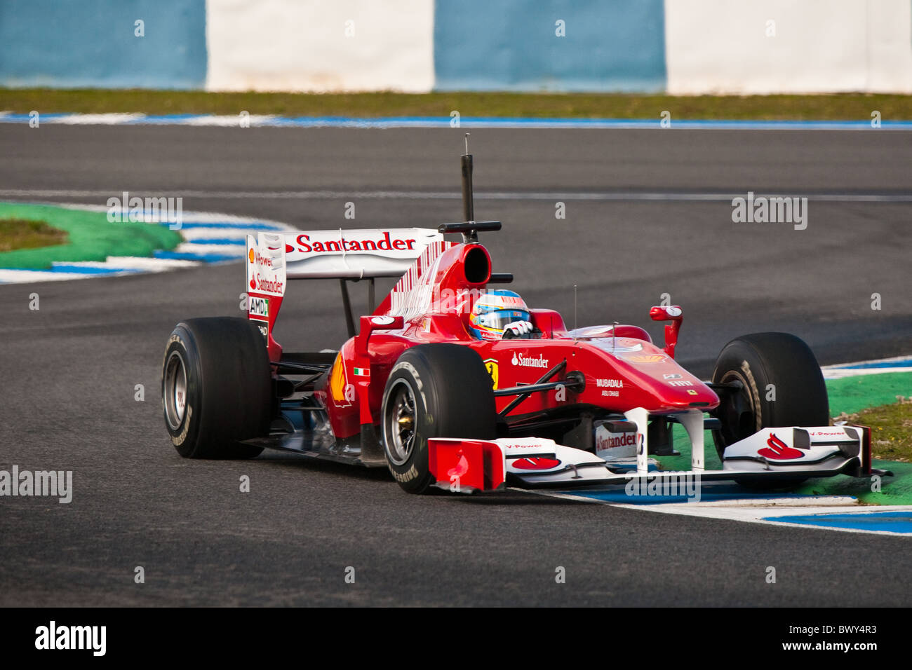 Fernando Alonso at the 2010 Jerez practice in his FERRARI, Formula 1 car at the  practice, leaving the chicane. Stock Photo