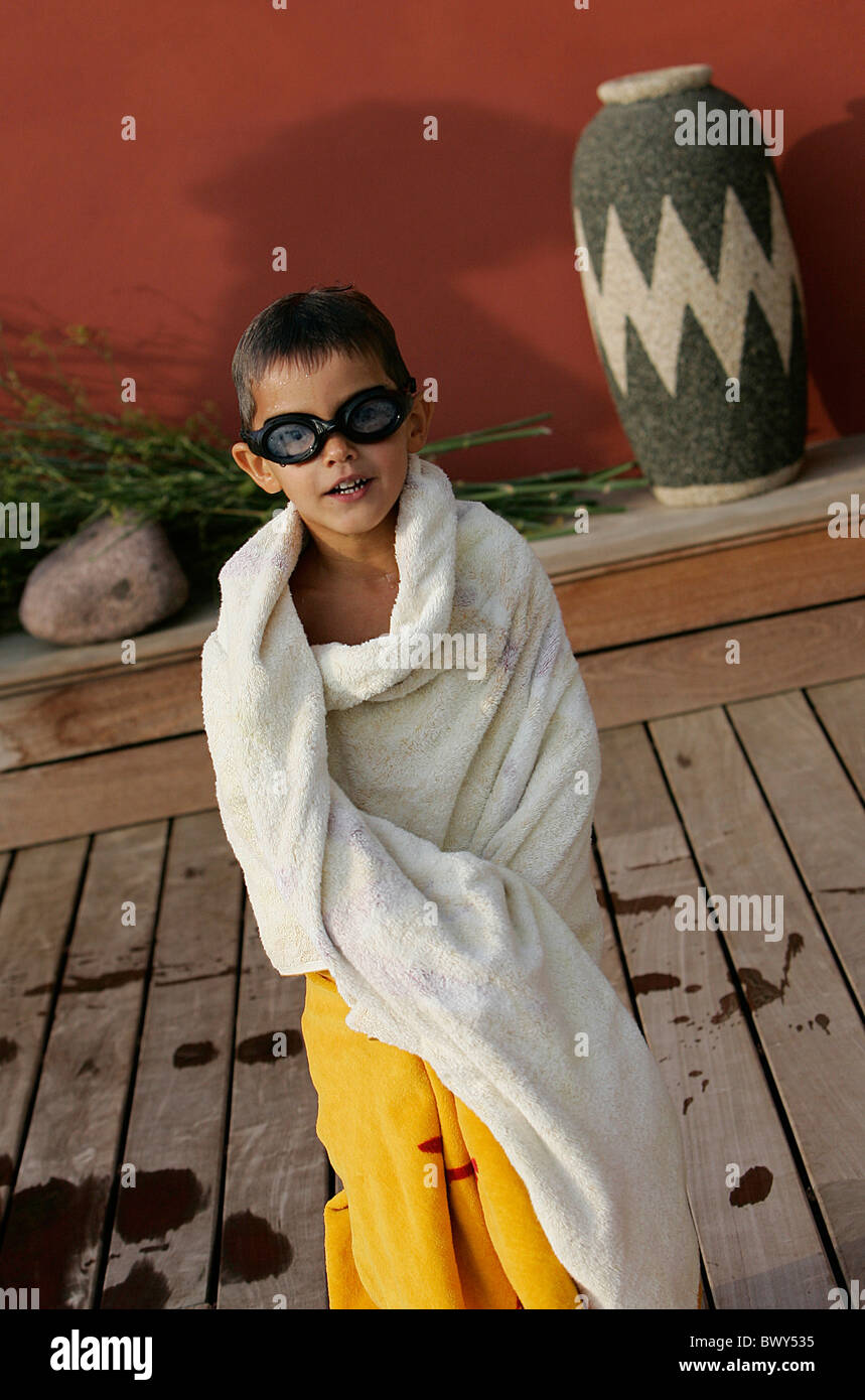 Portrait of young boy after a bath in a pool Stock Photo