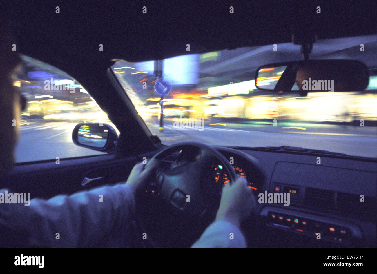 at night automobile car driver inside lights motoring moving night