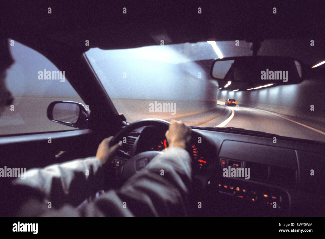 at night automobile car driver inside lights motoring moving night