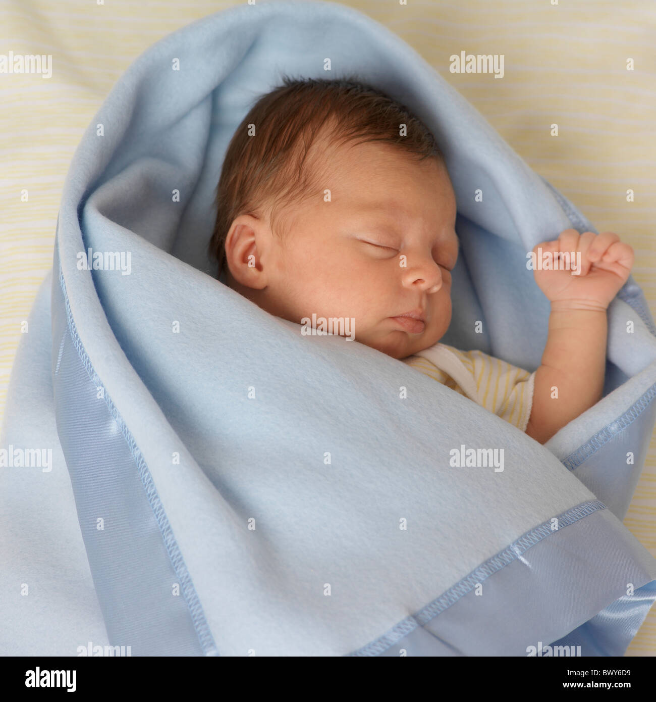 Sleeping Newborn Girl Wrapped In Blanket Stock Photo Alamy
