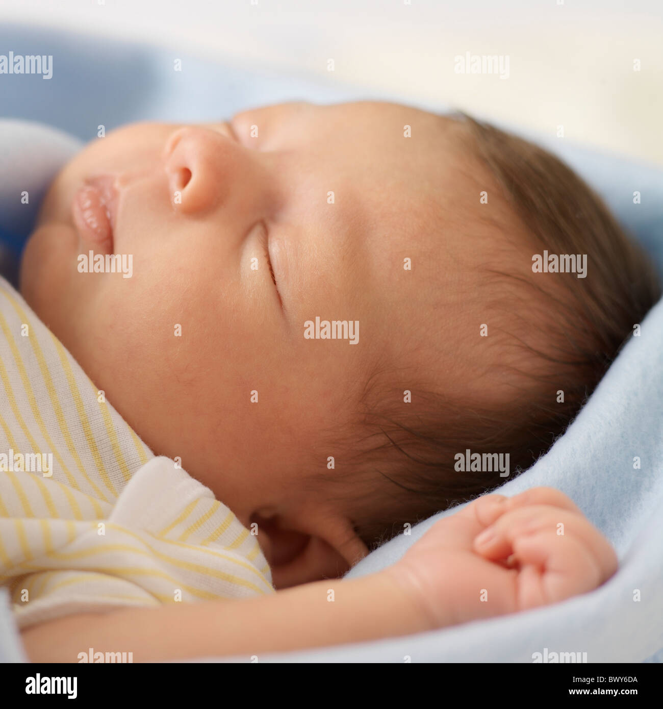 Sleeping Newborn Girl Wrapped In Blanket Stock Photo - Alamy