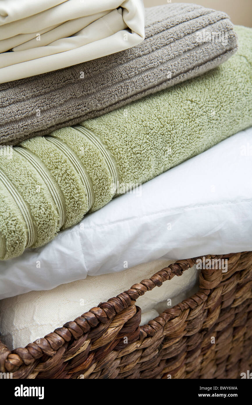 Basket with Folded Towels and Sheets Stock Photo Alamy