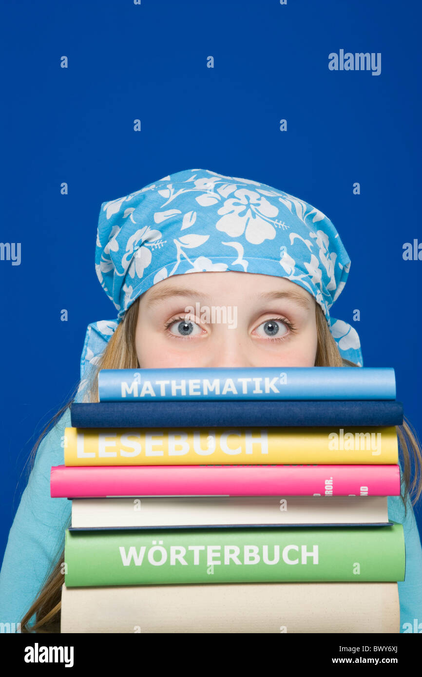 Young Girl With a Stack of Books Stock Photo