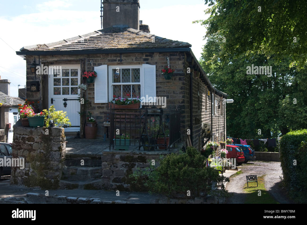 Stone Built Cottages (formerly the Post Office and village shop) in Higham Village in Lancashire England Stock Photo