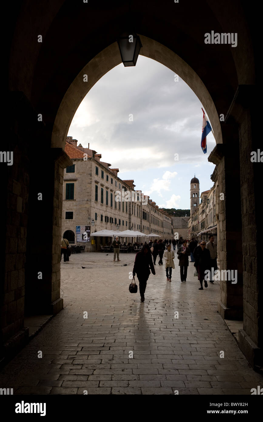 Dubrovnik Old Town's Stradum seen through an arch at one end. Stock Photo