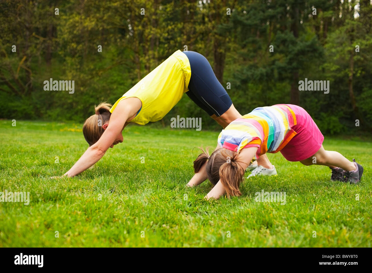 Mother and Young Daughter Exercising in the Park, Portland, Oregon, USA
