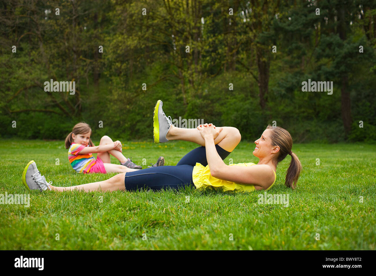 Mother and Young Daughter Exercising in the Park, Portland, Oregon, USA