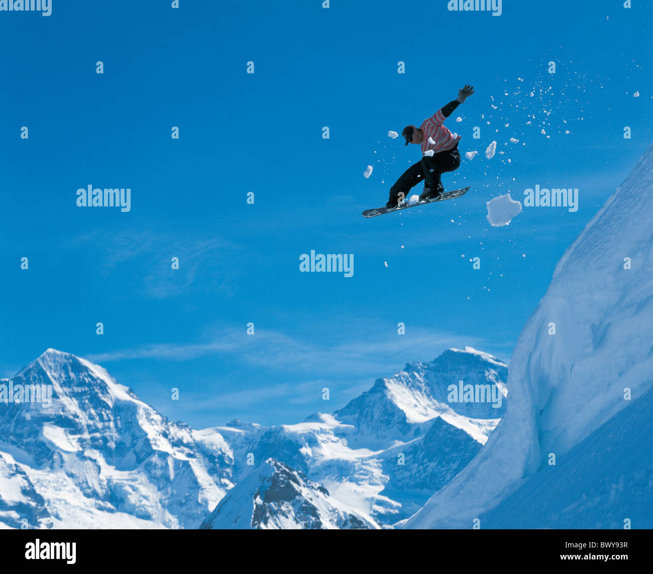 action Berne Canton Bern extreme inclination jump Jungfrau man Monch mountains slope snow snowboard Sno Stock Photo