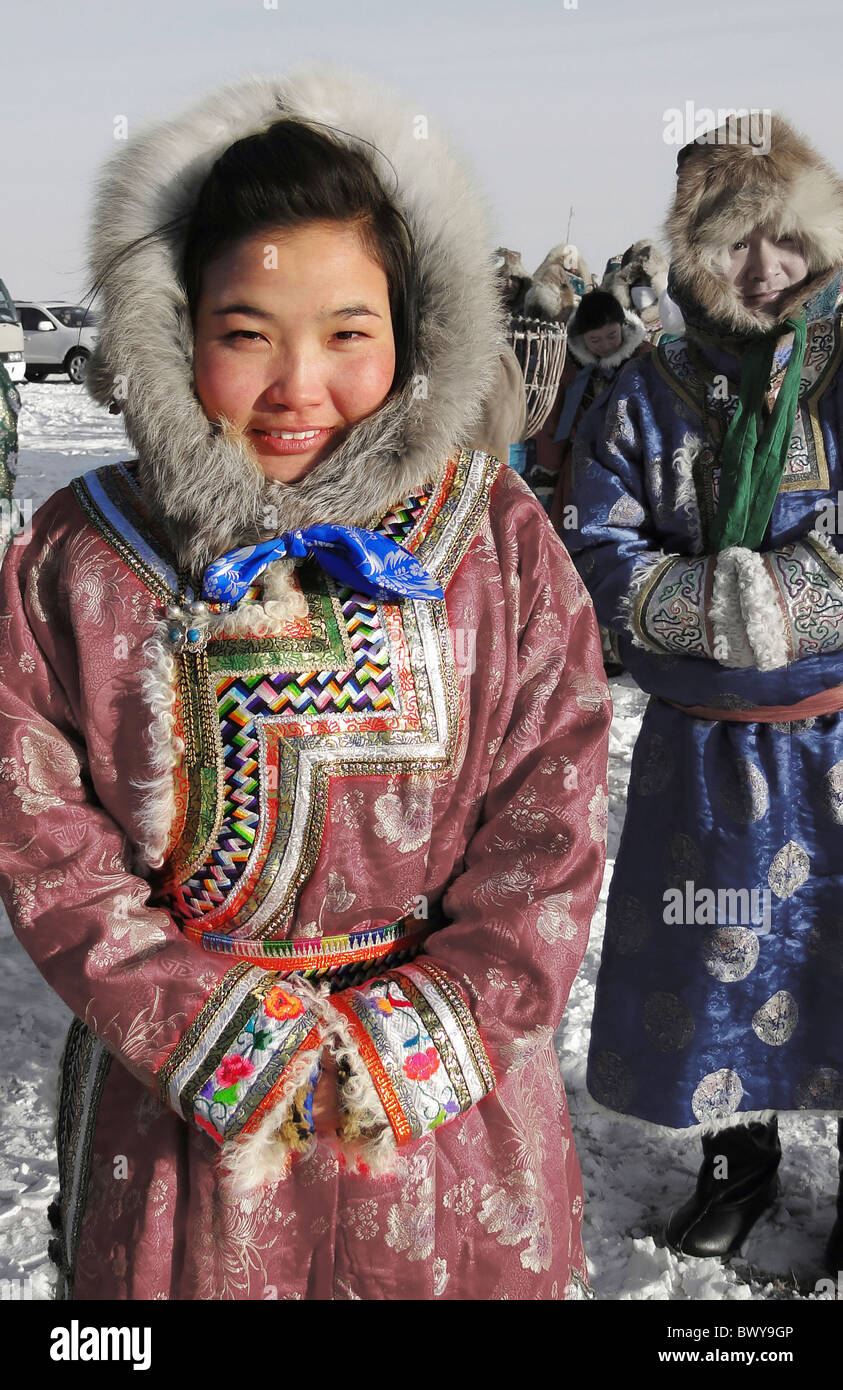 Mongolian woman in traditional costume in winter, Hulun Buir Grassland ...