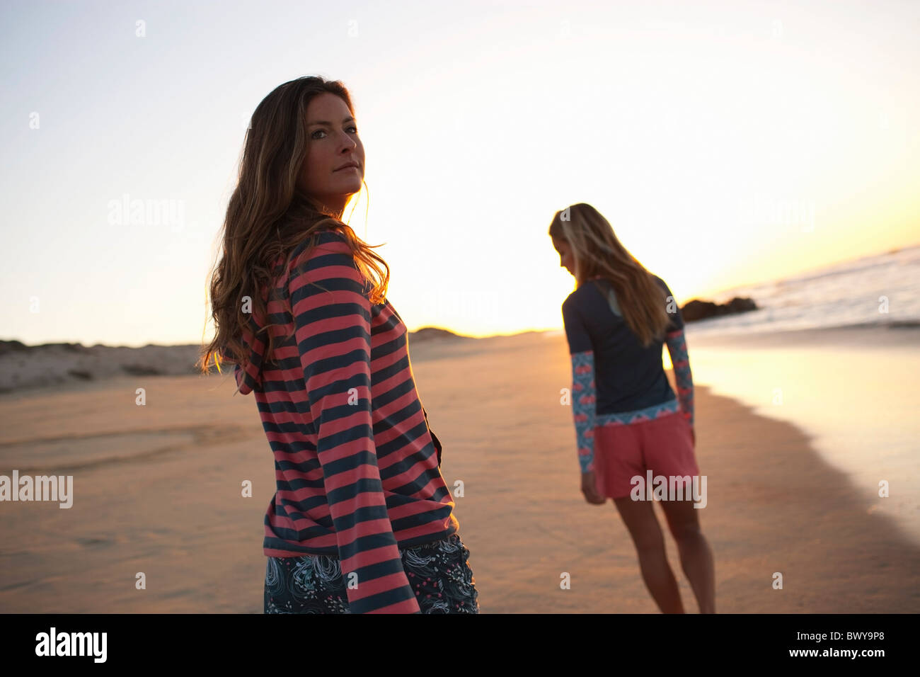 Two women only beach back view hi-res stock photography and images - Alamy