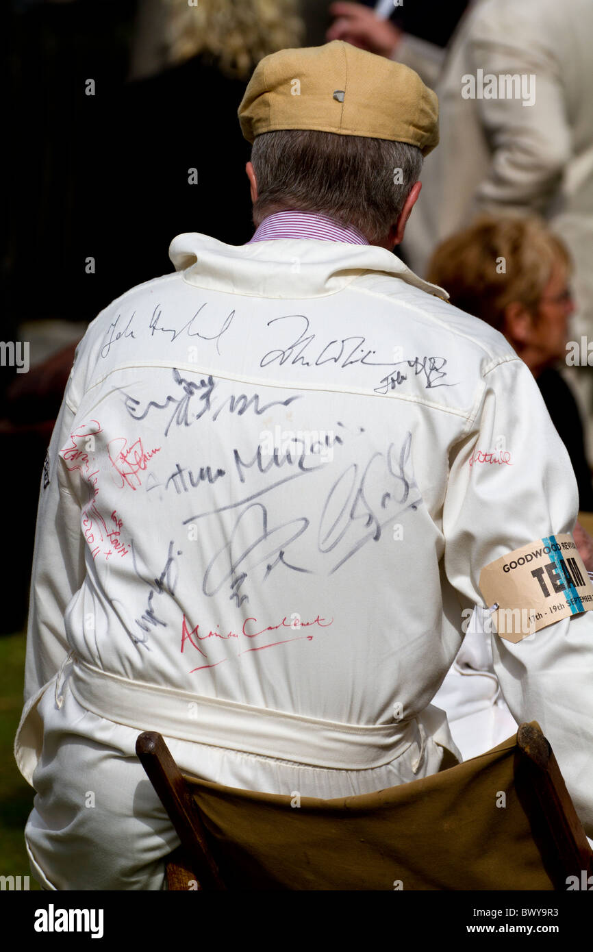 Racing team member in autographed overalls at the 2010 Goodwood Stock Photo  - Alamy