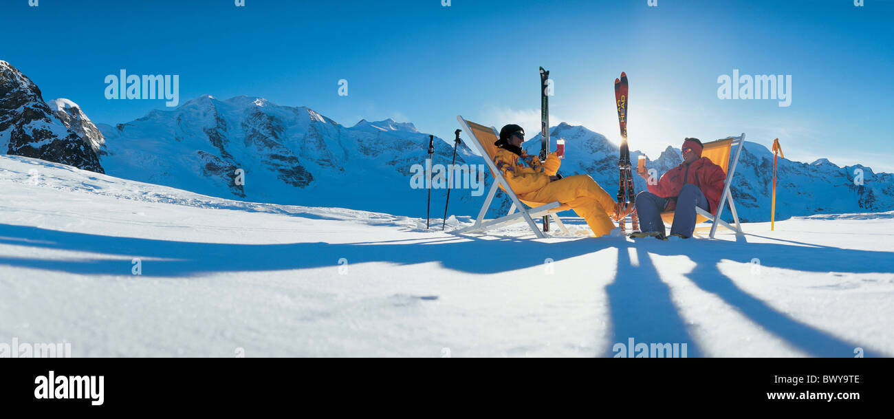 adjacent Apres ski Grisons Graubunden cocktails couple deck chair Diavolezza drinks Grisons Graubunden mo Stock Photo