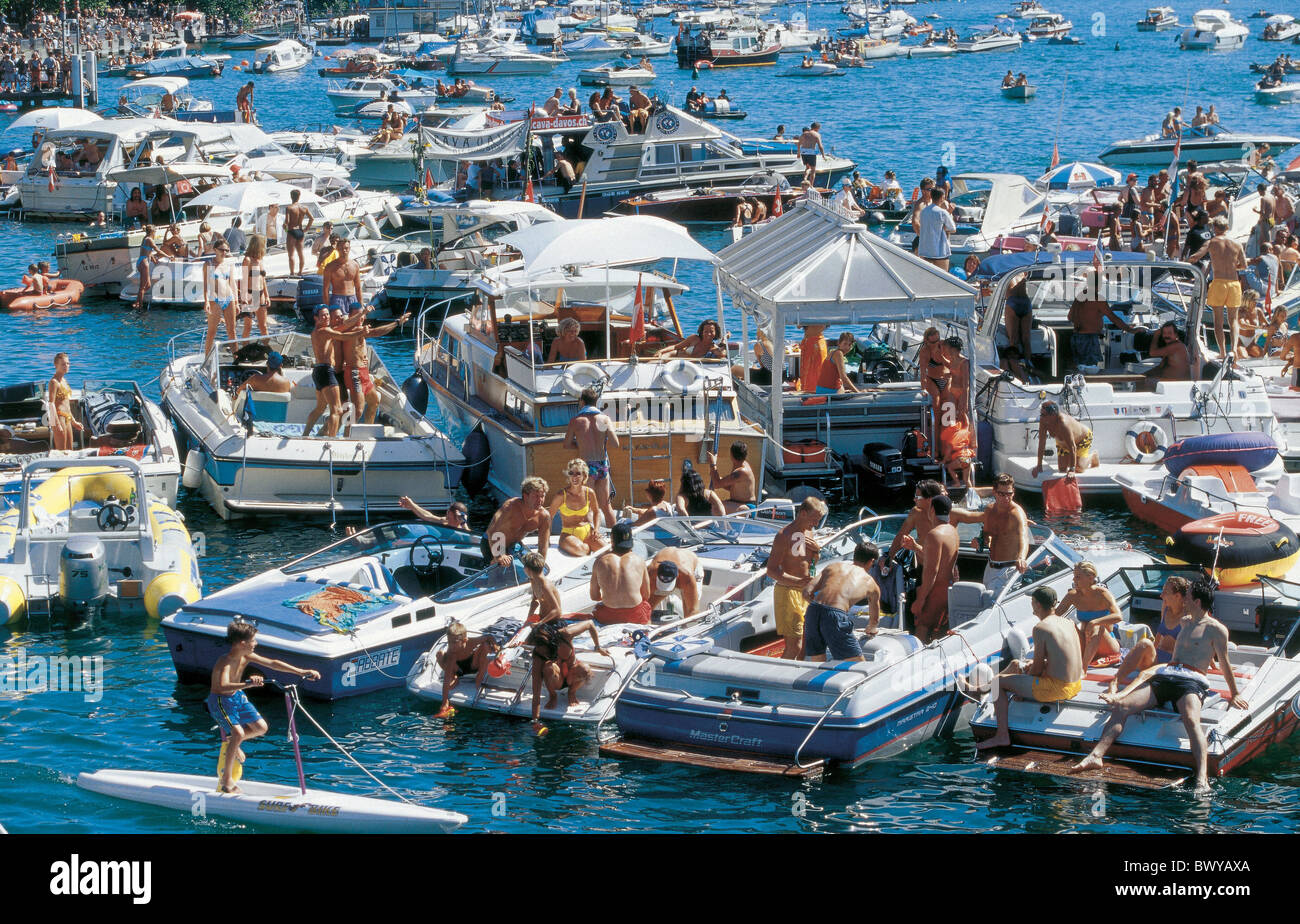 bathing boats city folks lake no model release party people scrum ships Street parade Streetparade summe Stock Photo