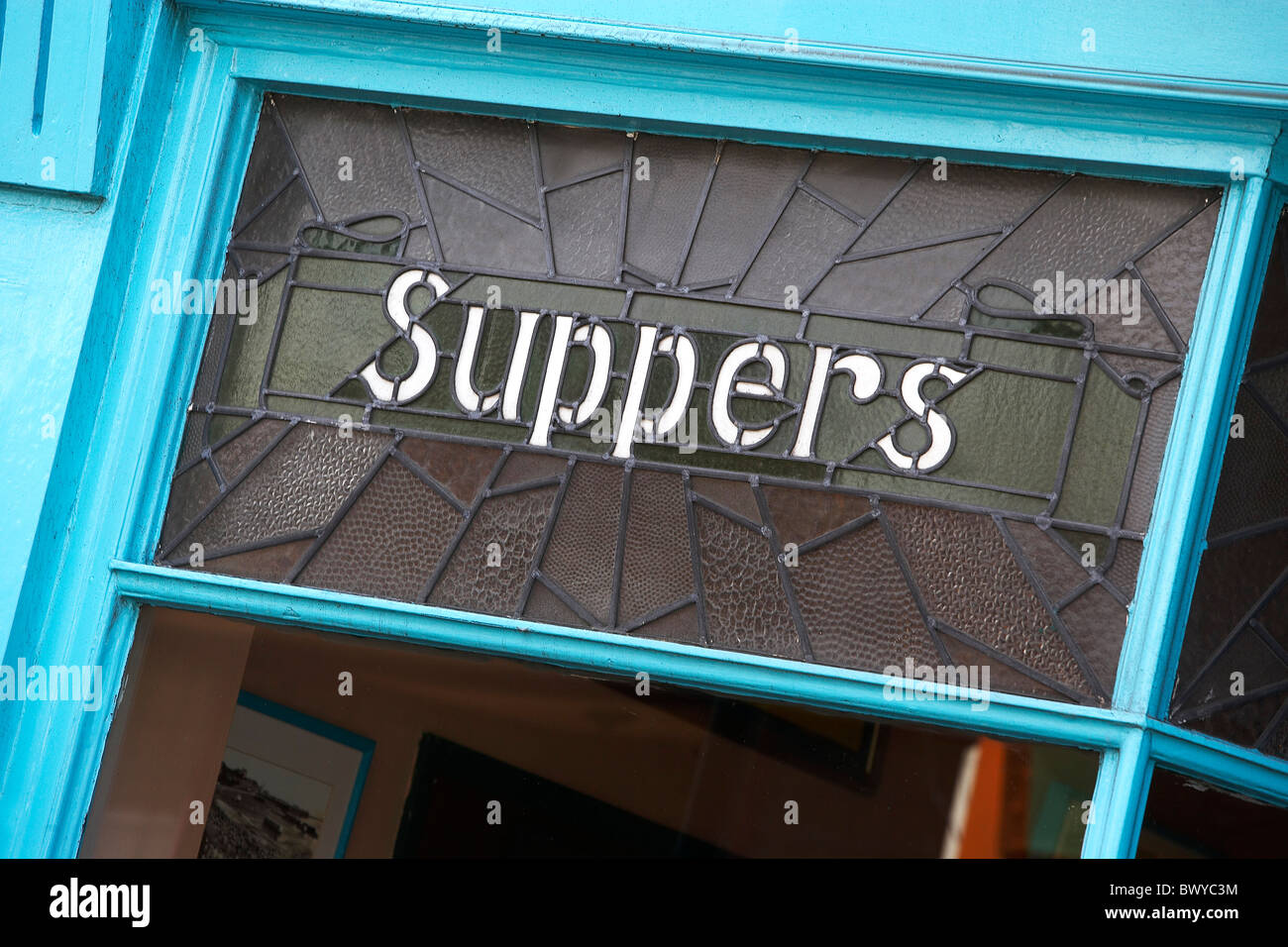 old seaside sign with 'suppers' Stock Photo