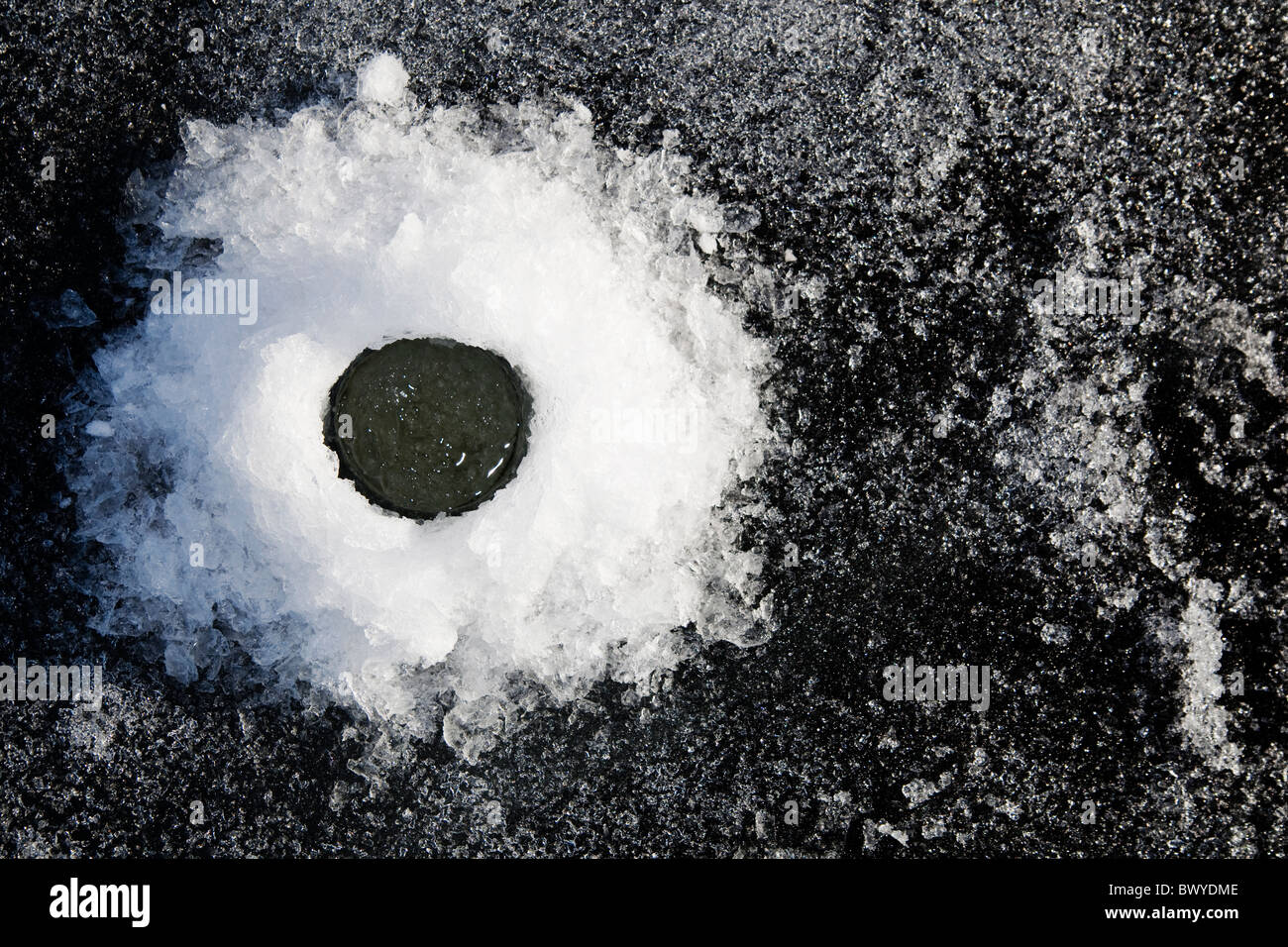 A drilled hole in the ice of Lake Nashulta(Näshulta) Sweden Stock Photo