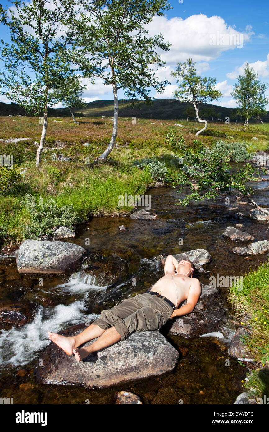 Man relaxing in a stream.Elga,Norway Stock Photo