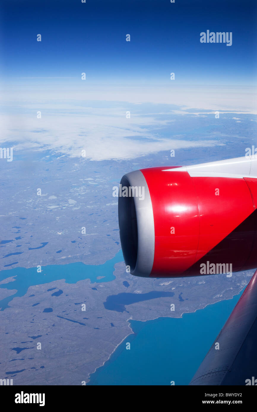Virgin Atlantic Airways 747-400s aircraft powered by  GE CF6-80C jet engines over Greenland Stock Photo