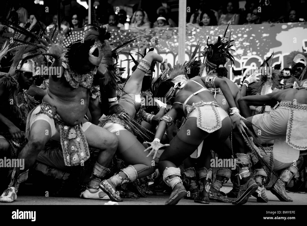 Trinidad carnival bodies writhing performing in front of Judges, black and white Stock Photo