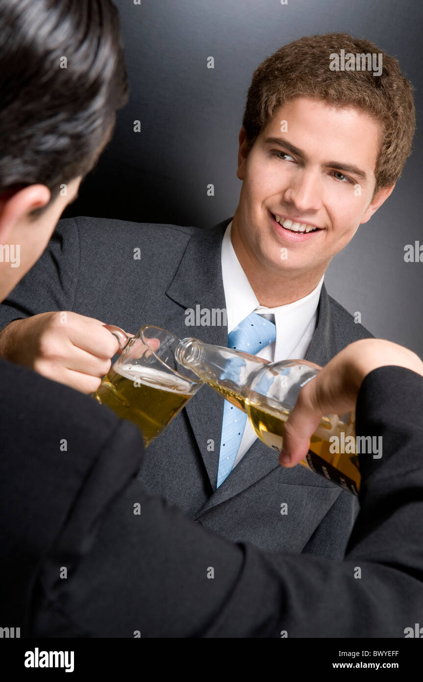 Businessmen toasting with beer Stock Photo Alamy