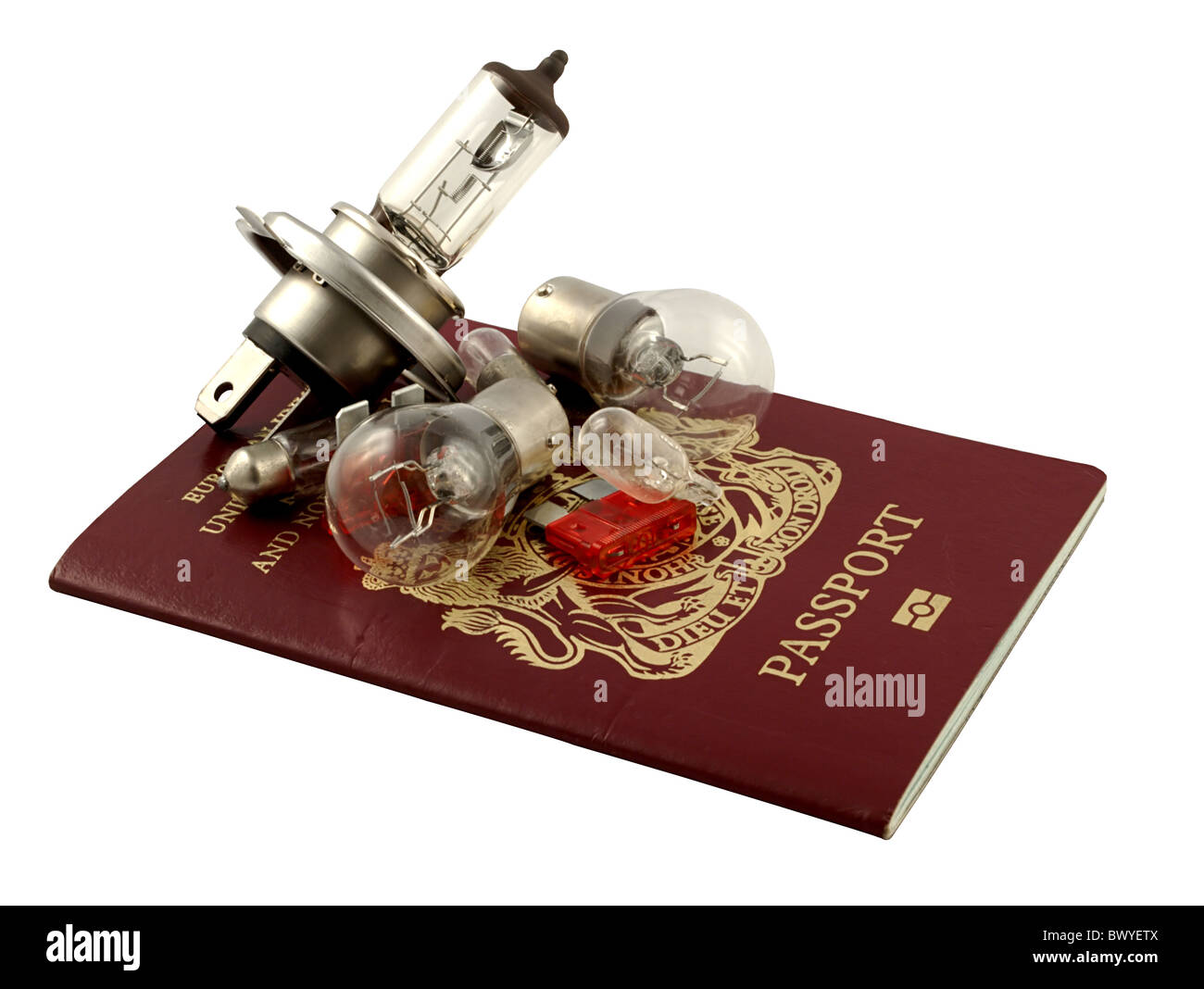 Passport and light bulbs, it's illegal not to carry spare bulbs driving abroad Stock Photo