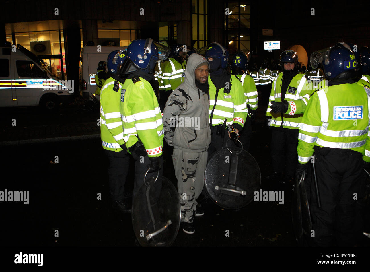Police arrest young black male at student protest in London Stock Photo