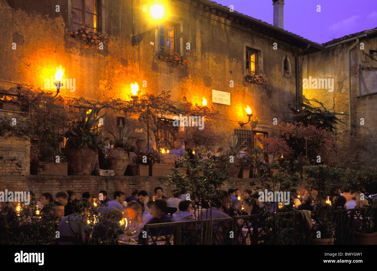 illuminated 10649721 outside guests company Italy Europe night at night Piazza dei Mercanti restaurant Rome Tavern Stock Photo