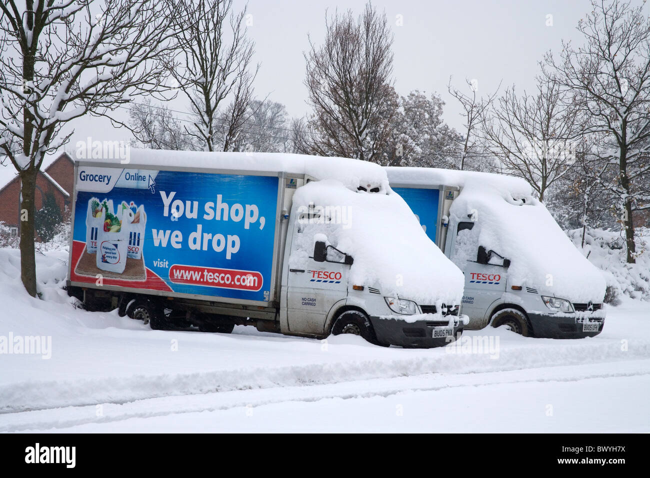 winter snow stops tesco delivery vans   burgess hill west sussex Stock Photo