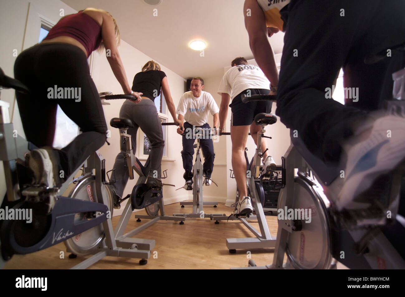 appliances bicycle bike coaches devices Ergometer Fitness fitness studio folks group health home coach i Stock Photo