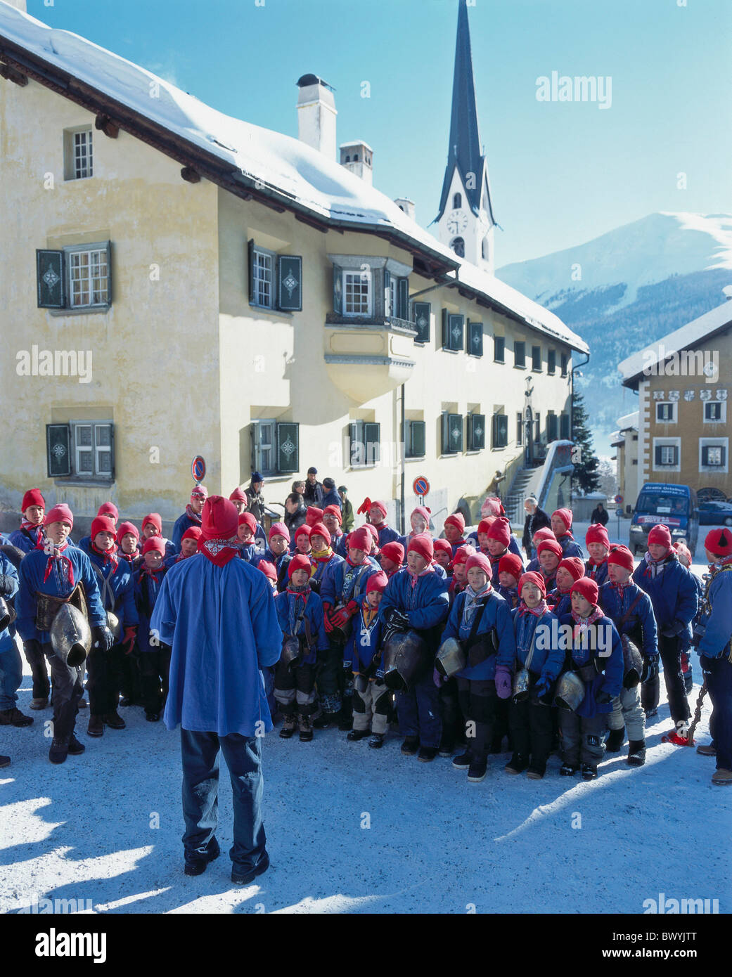 Lower Engadine Engadine tradition children alpine Alps mountains blue shirts tradition Chalanda Marz folkl Stock Photo