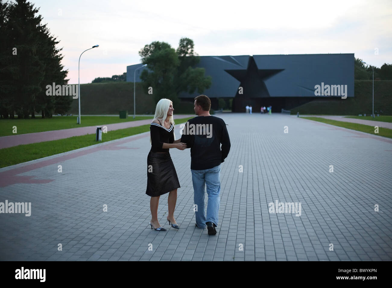 A couple in front of the main entrance to the Brest Fortress, Brest, Belarus Stock Photo