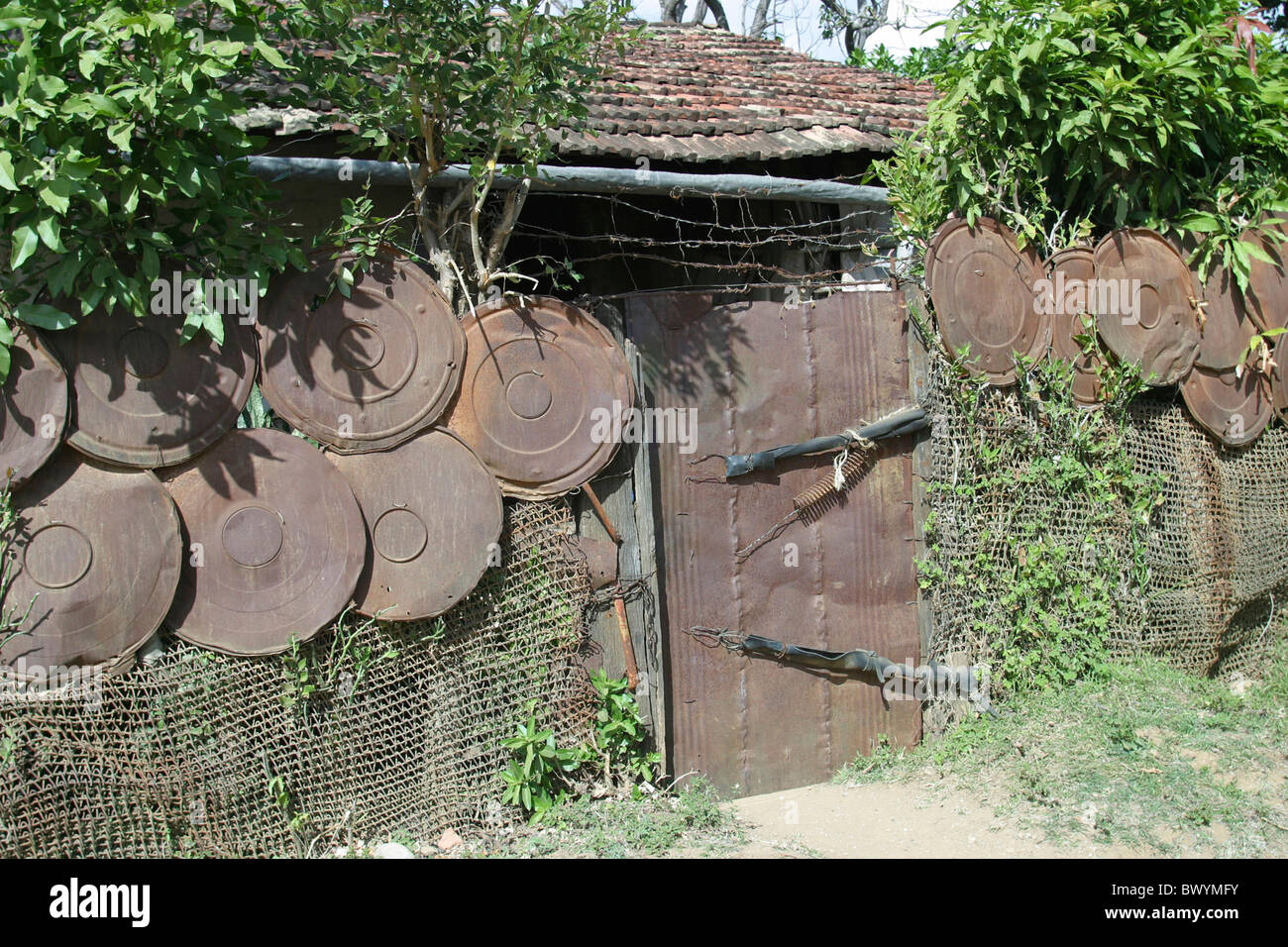 poverty property protected safely house home hut Cuba Caribbean protection sting wire burglary break-in Stock Photo