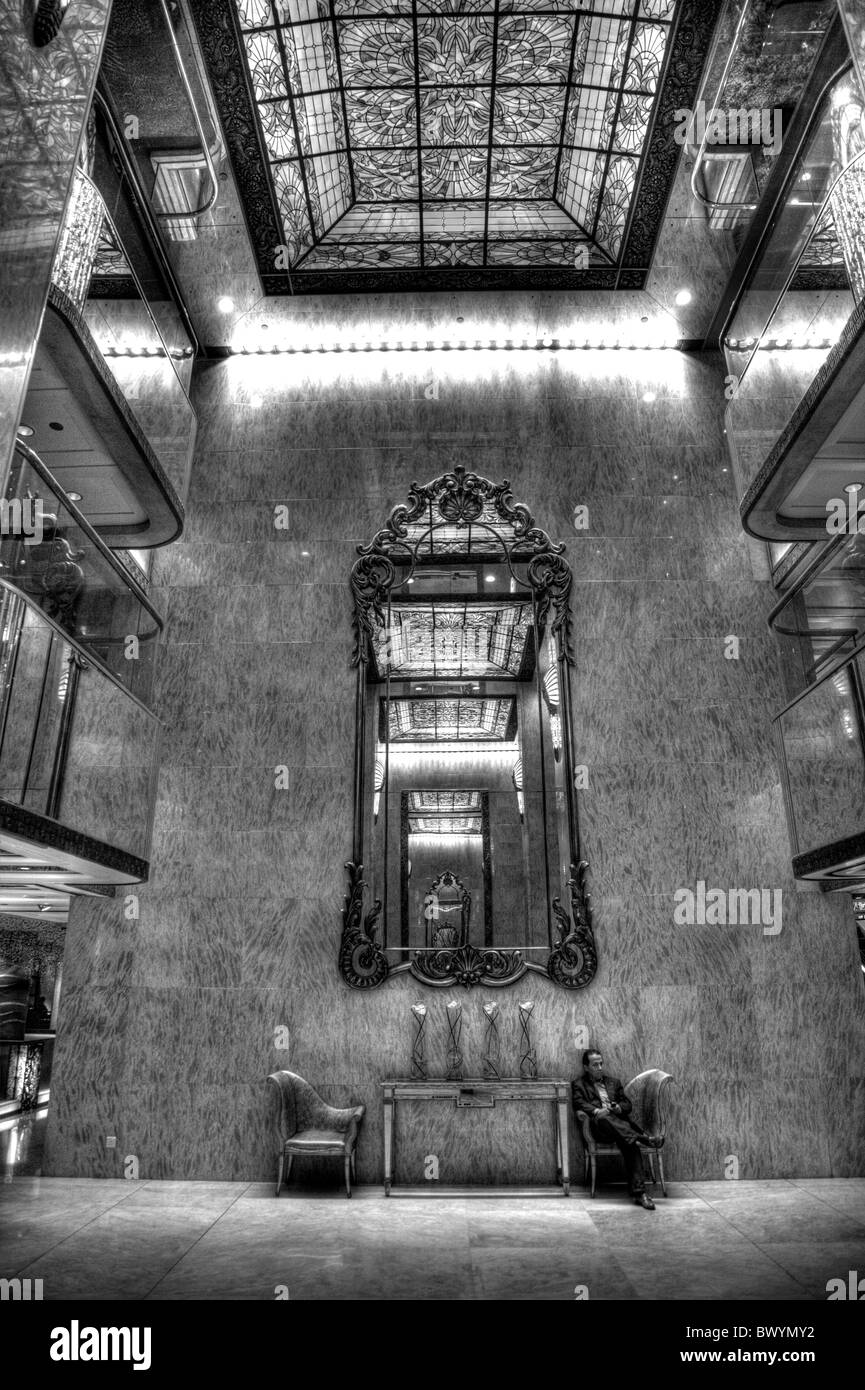 Interior of The Kowloon Regal Hotel, Hong Kong, huge mirrors and stained glass decorate the main entrance Stock Photo