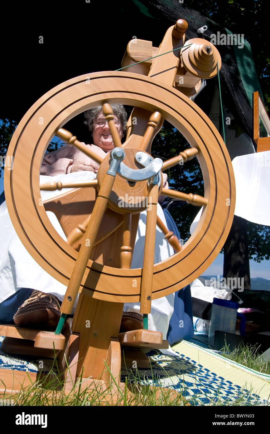Woman demonstrates how to spin wool at Living History fair on the grounds of Old Mission State Park in Cataldo, Idaho Stock Photo