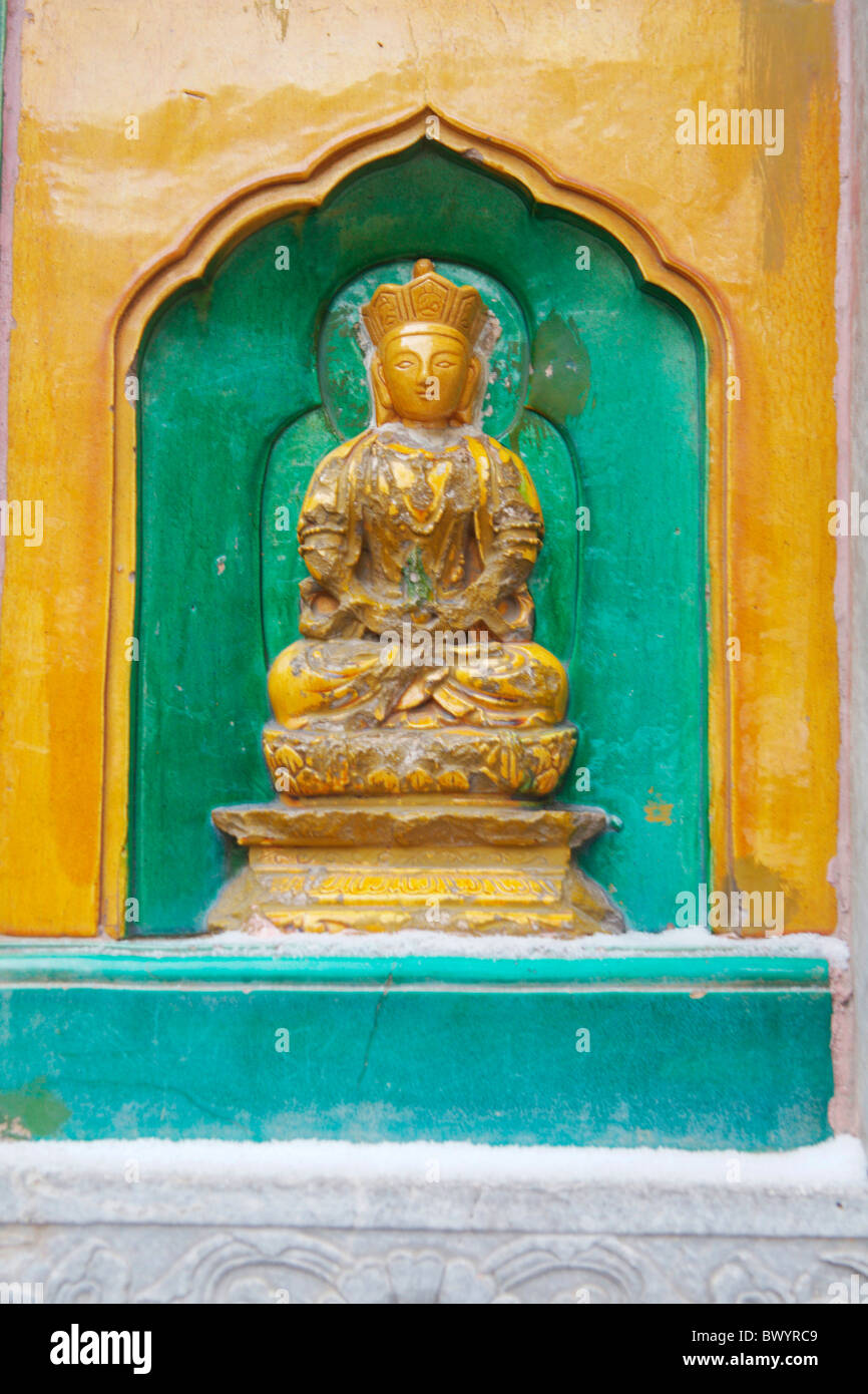 Buddha statue in niche on the wall of Hall of the Sea of Wisdom, Summer Palace, Beijing, China Stock Photo