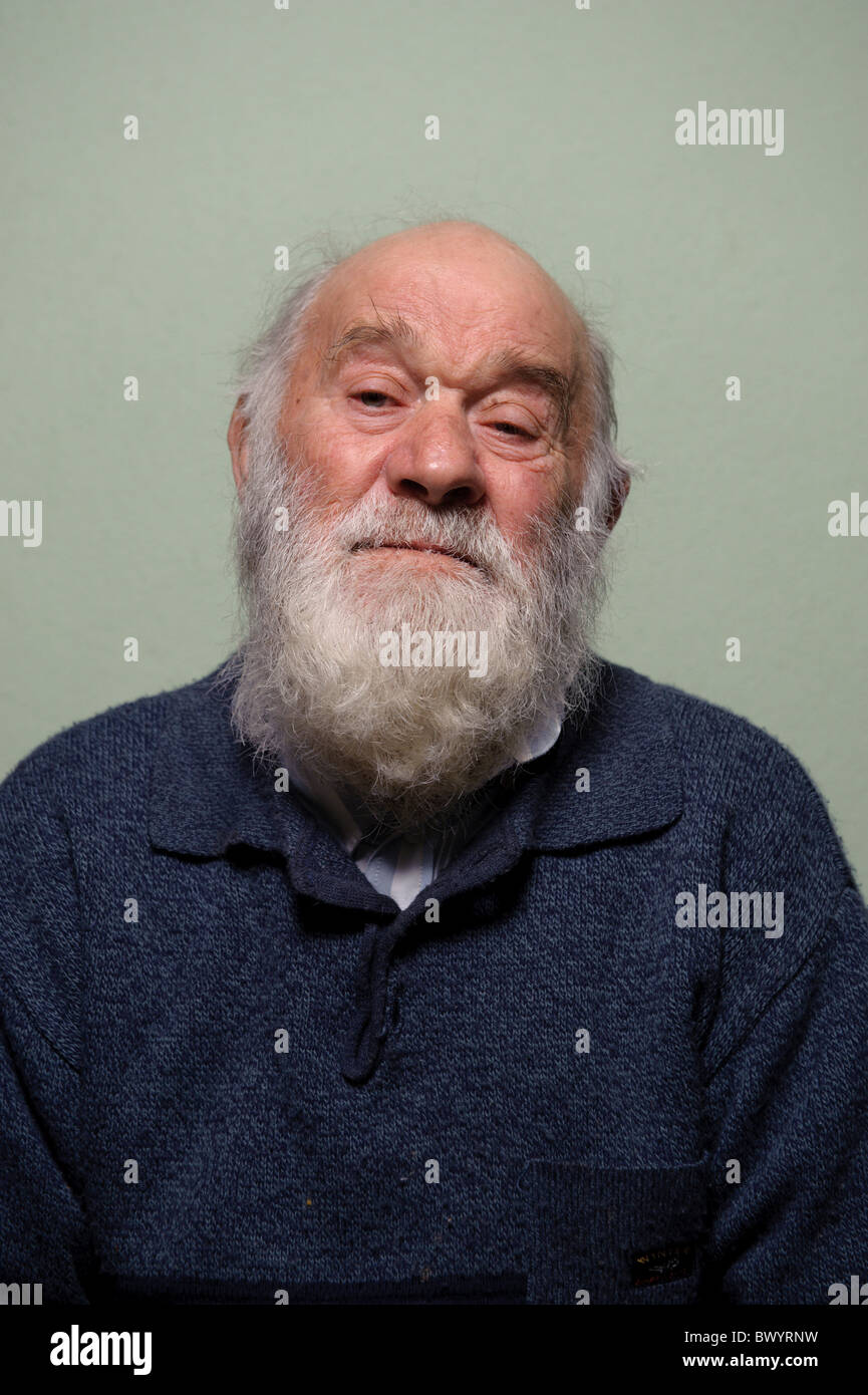 Isolated portrait of caucasian bald old man with long white beard Stock Photo