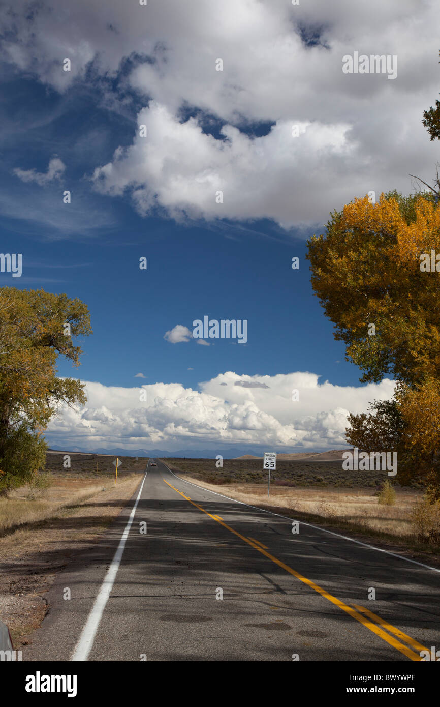 Manassa, Colorado - A lone car approaches on Highway 142 in Colorado's San Luis Valley. Stock Photo