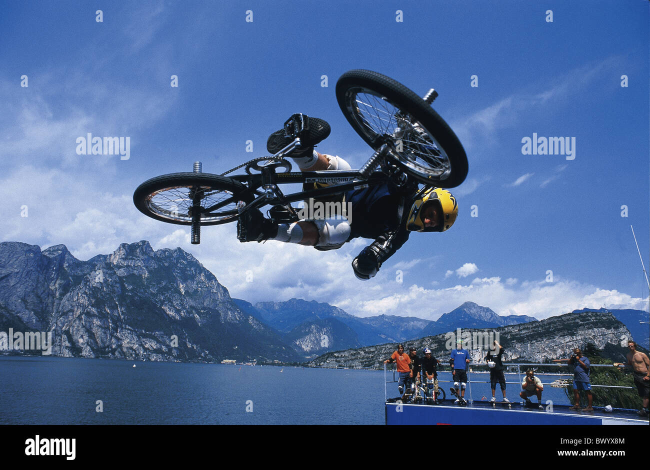 action arrangement bicycle bike Biking BMX competition Half pipe jump lake  man mountains Alps ramp spe Stock Photo - Alamy