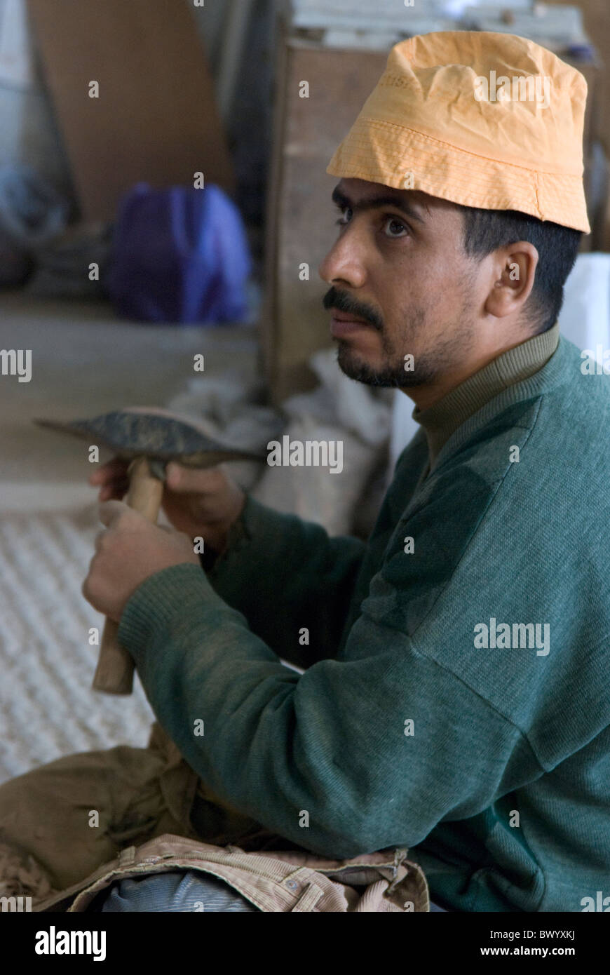 Ceramic factory in Fez, Morocco. Worker. Stock Photo